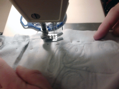 A photo of me sewing the patches together on my sewing machine